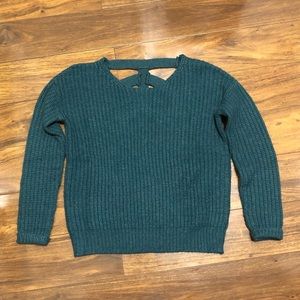A teal green sweater